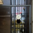 A hanging clock in the main entrance of the Art House 14